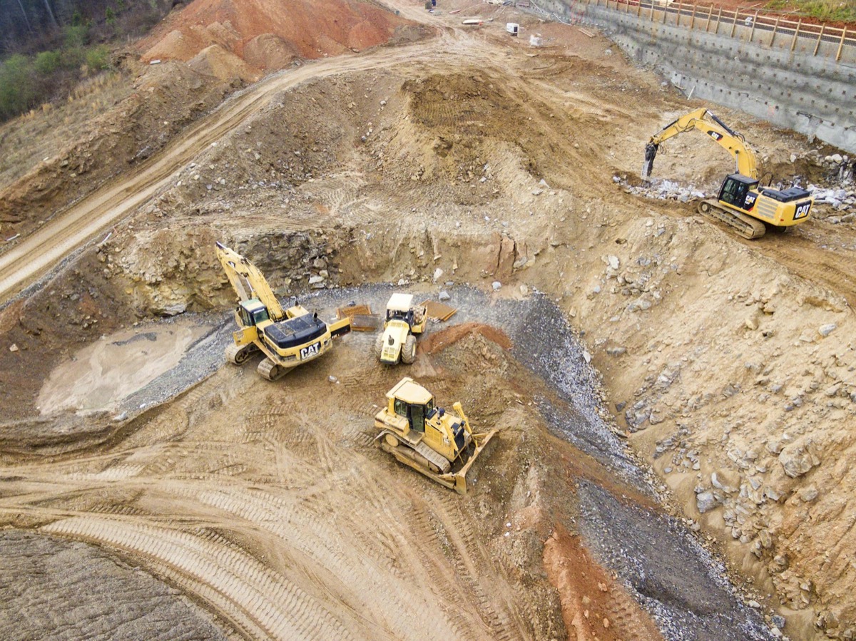 Excavators and loaders working on an earthworks site